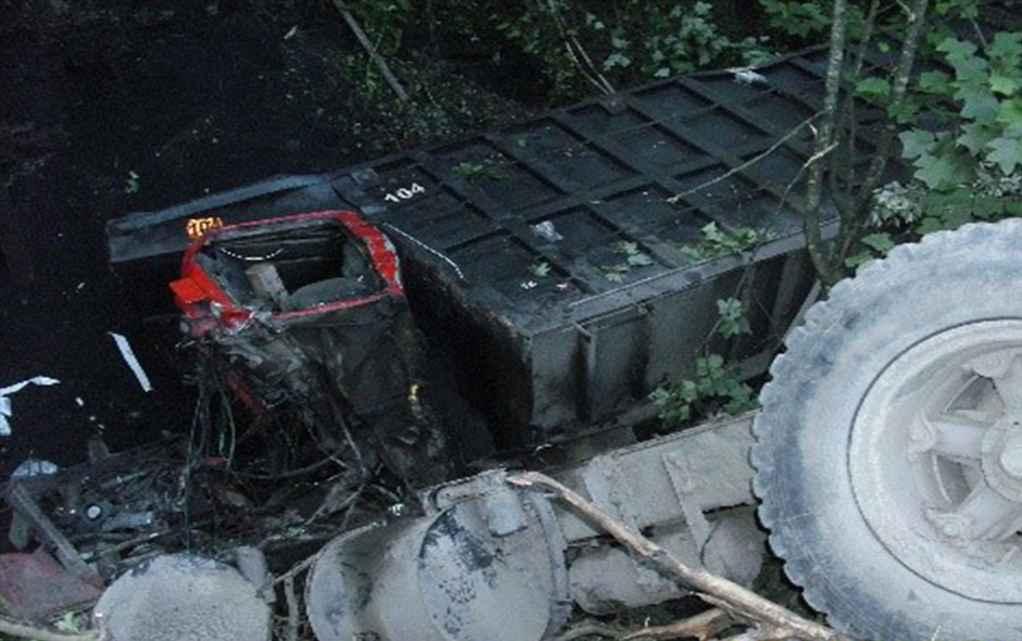 Truck fallen over embankment