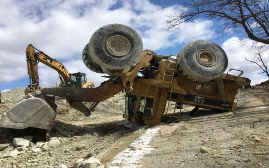 Front loader fallen upside down