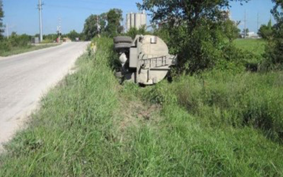 Water truck fallen off pavement on the road