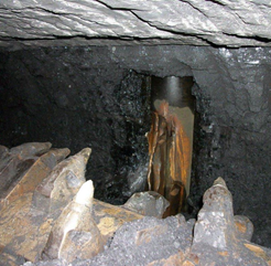 Well casing cut into by a continuous miner in an active coal mine.