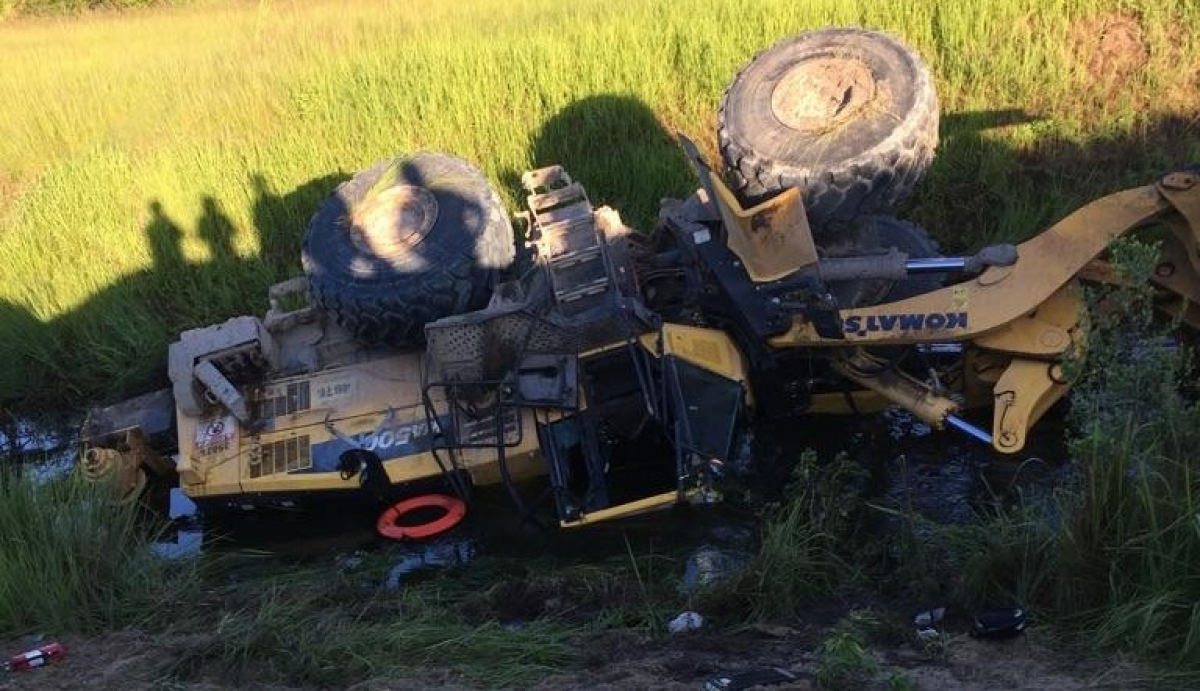 loader construction vehicle turned on its side