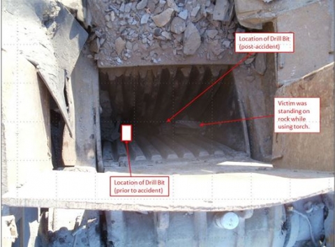 A top down view of a rock crusher. Labels identify key locations 