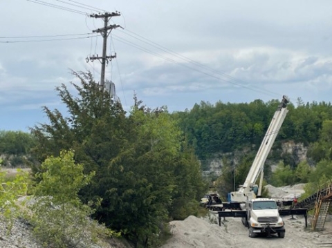 Accident scene where a miner was electrocuted while unloading a roll of belt from a trailer.