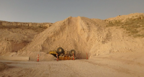 Accident scene where a miner died when the haul truck he was operating over travelled a dump point.