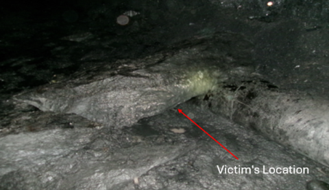 Accident scene where a continuous mining machine operator died after being struck by a rock from a roof fall.