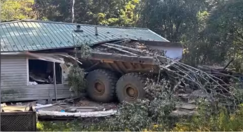 Haul truck crashed into a residence.