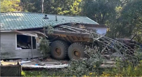 Haul truck crashed into a residence.