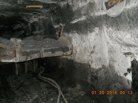 A continuous mining machine against a coal rib