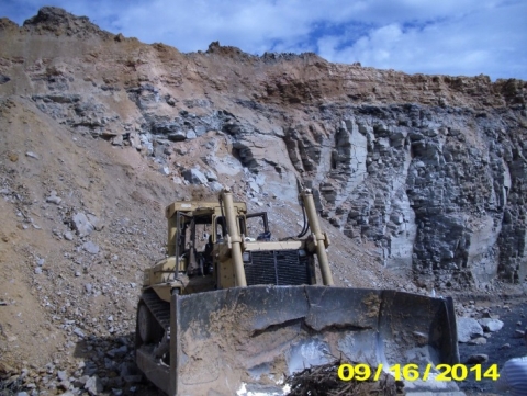 Photo of the bulldozer that had fallen off the edge of the highwall