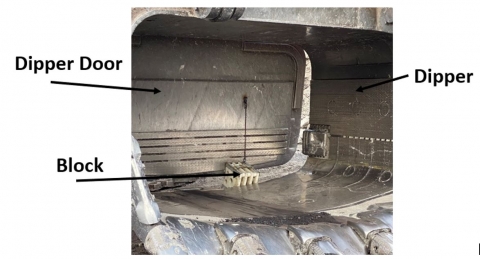 Accident scene where a contract mechanic received fatal injuries while performing maintenance on the bucket (dipper) of an electric rope shovel.