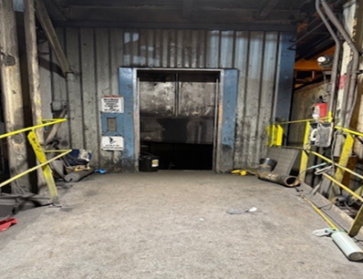 Accident scene where while performing elevator testing, a miner died when the elevator descended and struck him on the first-floor platform.
