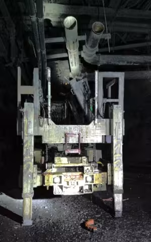 Accident scene where a utility management miner died, and another miner was seriously injured, while removing unused waterline pipe suspended from a mine roof.