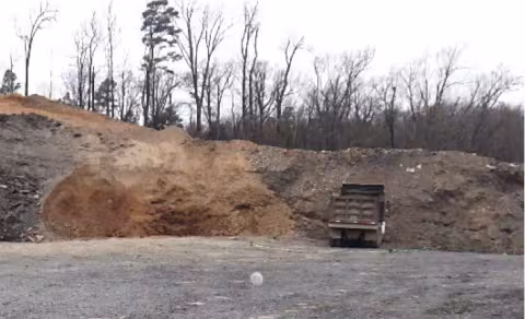 Accident scene where a dump truck rolled backward onto a 54 year-old miner while the miner was attempting to troubleshoot a brake issue.