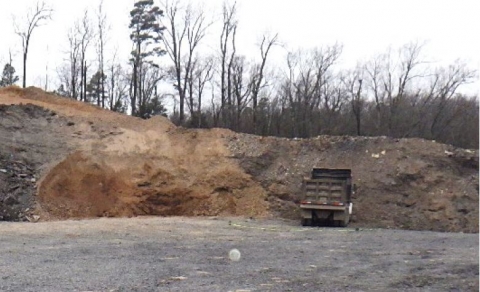 Accident scene where a dump truck rolled backward onto a 54 year-old miner while the miner was attempting to troubleshoot a brake issue.