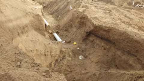 Accident scene where a miner died when an excavated trench collapsed and engulfed him.