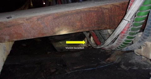 Accident scene where a miner died after a longwall shield hydraulically collapsed on him while performing maintenance on the shield.