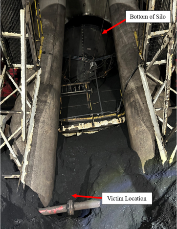 Accident scene where a contract miner was seriously injured after being engulfed by coal spillage while shoveling beneath a silo.