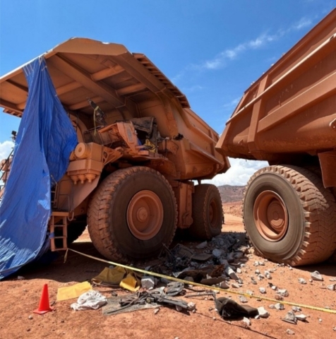 Accident scene where a miner died when the haul truck he was operating collided with another haul truck.
