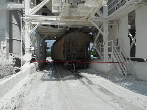Accident scene where a miner died when a covered hopper railcar derailed and pinned him against a structural beam of a train load out silo.