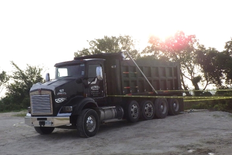 Accident scene where a customer truck driver died when he was struck by a component of his truck’s air bag height/ride suspension system while performing maintenance.