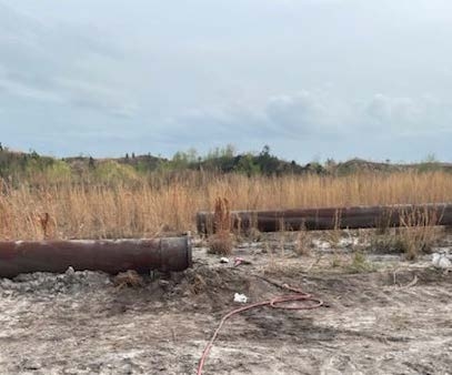 Accident scene where a miner died after a metal slurry pipe struck him.