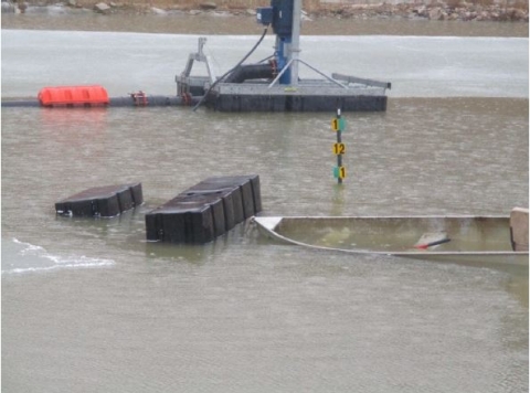 Accident scene where a 44 year-old heavy equipment operator drowned after the floating pump station he was standing on capsized.