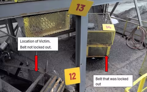 Accident scene where a miner died while clearing strips of old belt rubber from a belt conveyor tail roller. 