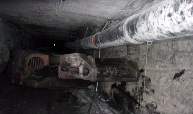 Accident scene where a continuous mining machine operator died after being pinned against the coal rib by a continuous mining machine.
