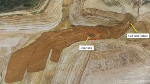 Accident scene where an excavator operator died after material from a tailings cell engulfed the excavator he was operating.