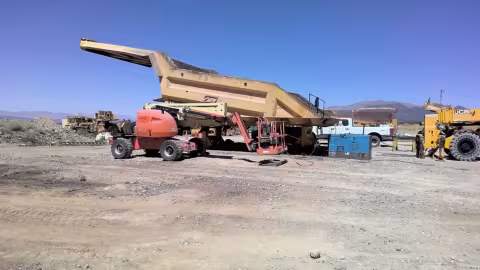 Accident scene where a contractor was injured when the rigging of an elevated truck bed liner broke, causing the liner to strike him.