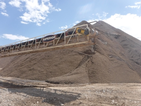 Accident scene where a miner died while attempting to clean material from the troughing rollers of the stacker belt.