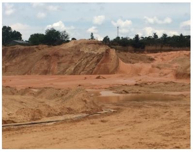 Accident scene where a 24-year old haul truck operator, with 9 months of experience, and a 56-year old hydraulic excavator operator, with 6 years of experience, were killed at a sand and gravel operation.