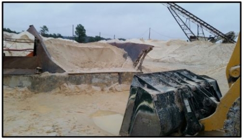 Accident scene where a 62-year old Front-end Loader Operator with 6 years of mining experience was fatally injured at a sand and gravel surface mine.