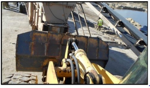 Accident scene where a 61 year old Equipment Operator, with 3 years of experience, was fatally injured at a sand surface mine.