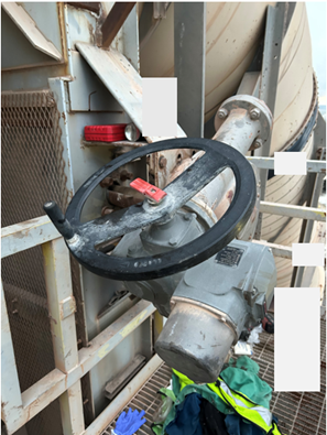 Accident scene where a contractor was fatally struck by the motor and gearbox assembly while removing a baghouse slide gate. 