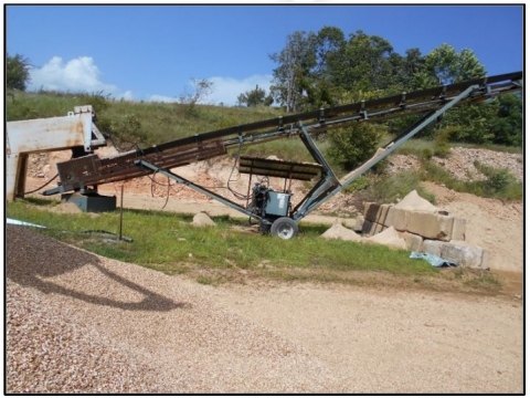 Accident scene where the miner was injured when his arm became entangled in a stacker conveyor belt