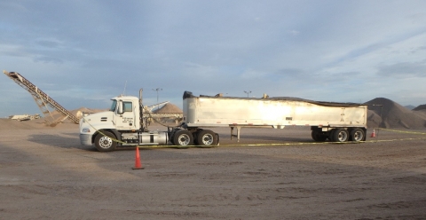 scene of accident where the driver died after falling from the top of his trailer