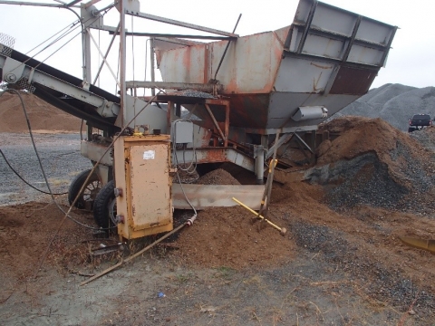 Accident scene where a 25-year-old miner was fatally injured when he entered a surge bin used as a feed hopper and was engulfed by material