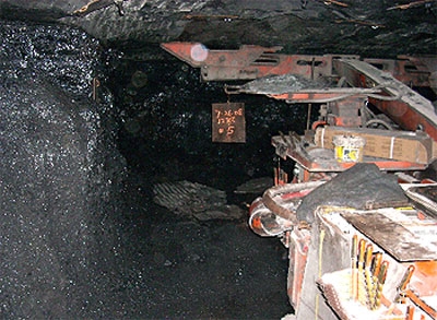 Accident scene where a 44 year old roof bolter operator with 20 years mining experience was fatally injured while marking the location for roof bolts to be installed.