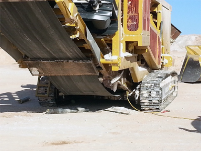 A mobile track-mounted crusher