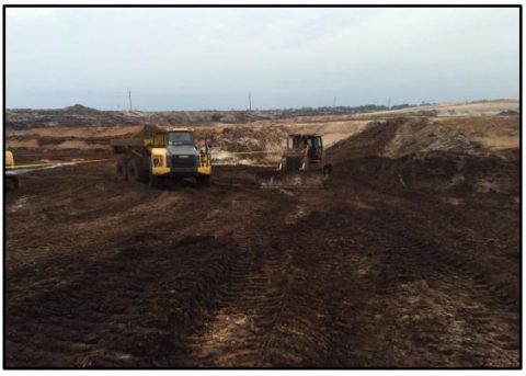 Accident scene where a 61-year old dozer operator with 18 years of mining experience was fatally injured at a surface titanium ore mine.