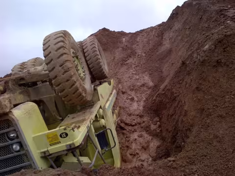An overturned truck that fell down the bank