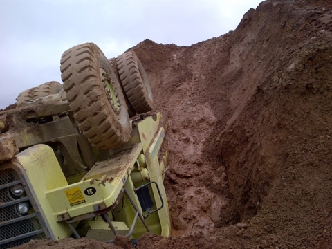 An overturned truck that fell down the bank