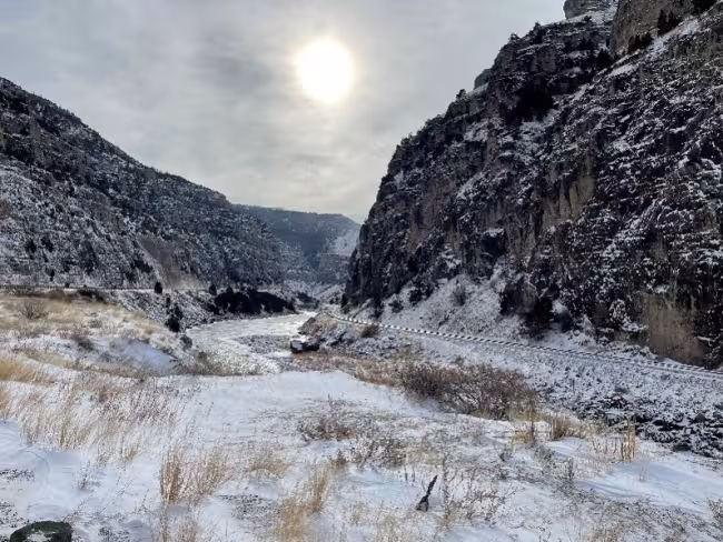 Winter safety alert showing a ravine next to train tracks 