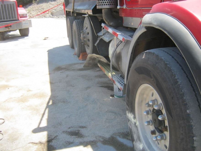 Blown fuel tank on side of truck