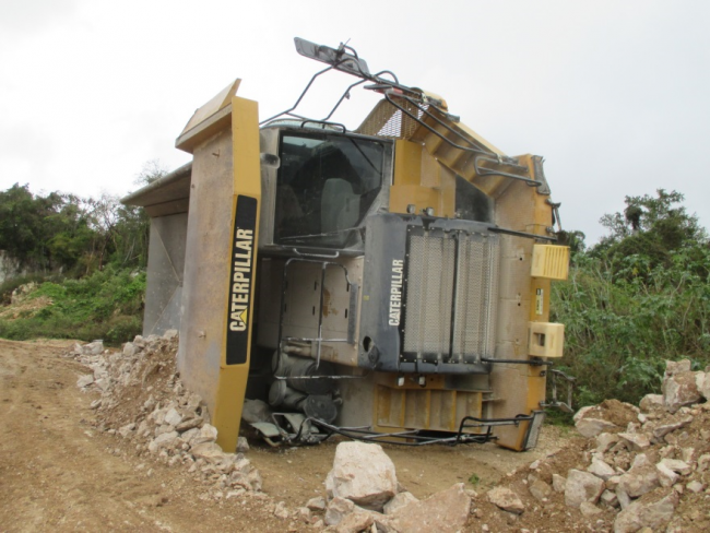 haul truck on its side