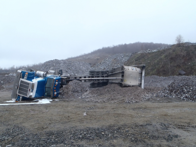 Blue overturned semi-trailer