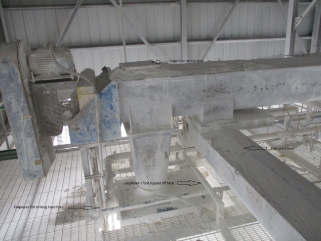 Accident scene where a miner was trying to determine why clay was not flowing properly by examining a chute that discharged into a screw conveyor.