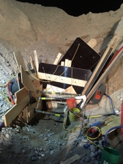 Accident scene where two miners were attempting to access a plugged grizzly screen by excavating a slot cut trench when the trench walls collapsed, engulfing the miners