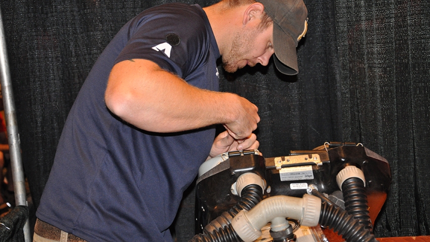 A rescue team member checking a breathing apparatus.